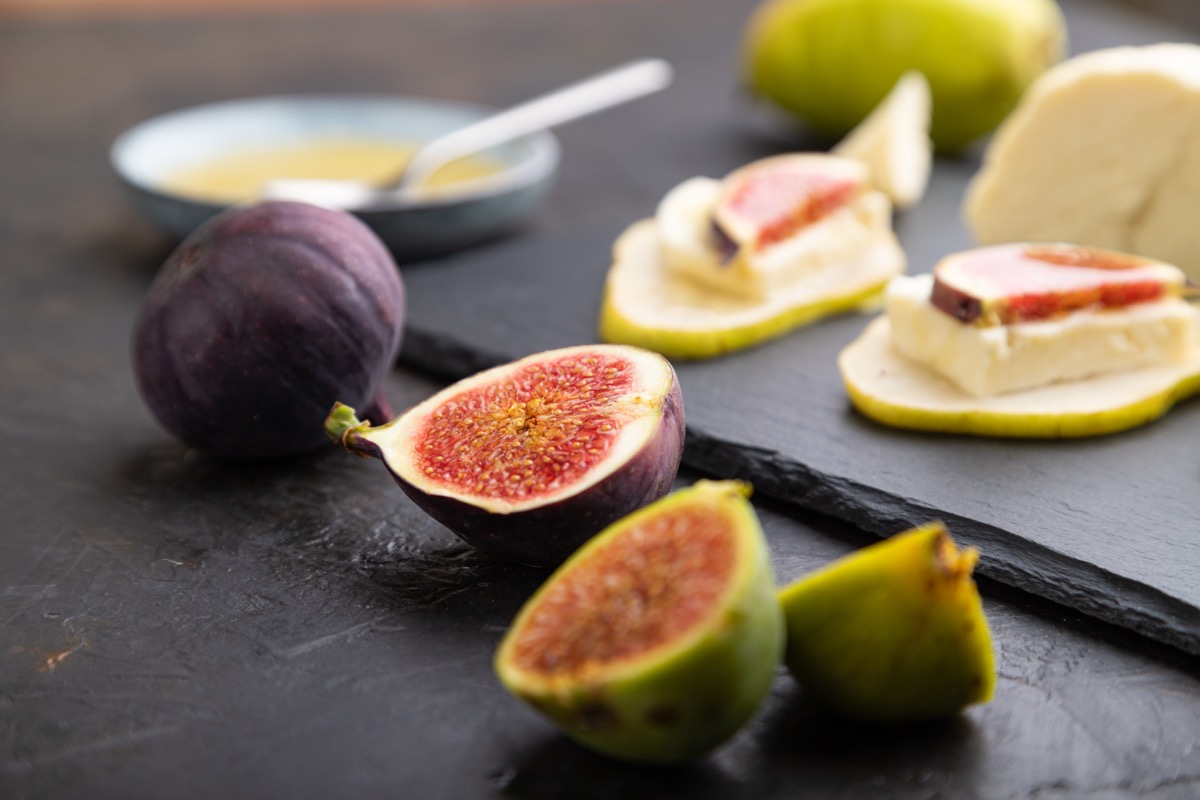 Figs and pears on a slate board